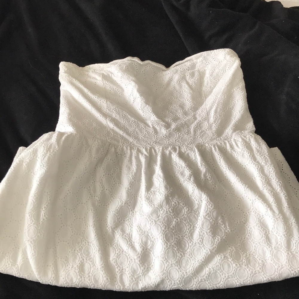 Strapless white lace dress.